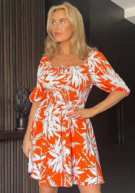 Pleated skirt – Skirt with folds or pleats, adding volume and texture to the fabric.Girl In Mind Cora Palm Print Shirred Detail Mini Dress, Orange