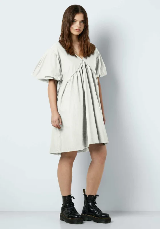 Asymmetrical skirt – Skirt with an uneven or diagonal hemline for a modern and unique appearance.Noisy May Chiara Mini Smock Dress, Bright White