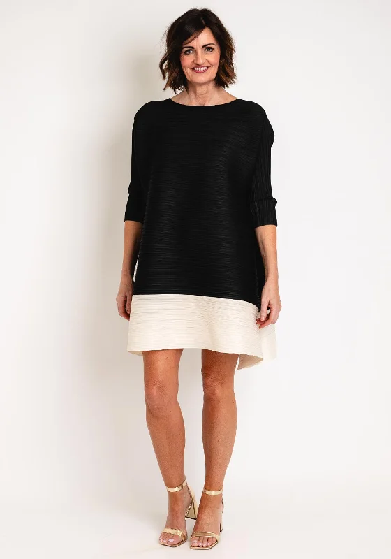 Asymmetrical skirt – Skirt with an uneven or diagonal hemline for a modern and unique appearance.Thanny Pleated Contrast Trim Mini Dress, Black