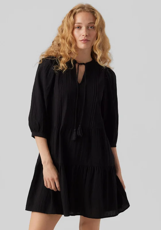 Asymmetrical skirt – Skirt with an uneven or diagonal hemline for a modern and unique appearance.Vero Moda Pretty Tiered Smock Mini Dress, Black