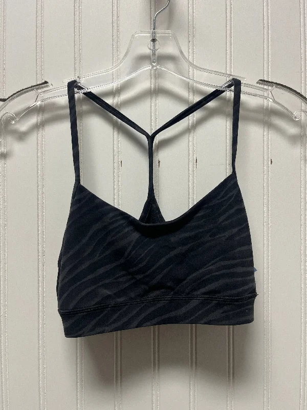 Racerback sports bra – Sports bra with a back design that features straps that meet in a "V" or "Y" shape, offering better shoulder mobility.Athletic Bra By Lululemon In Black & Grey, Size: S