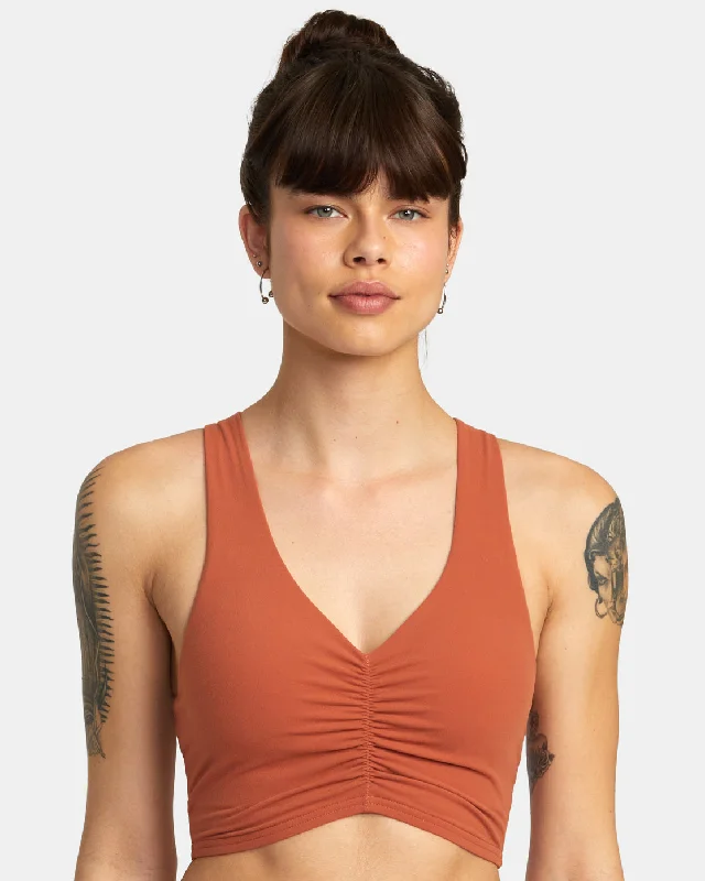 Wireless sports bra – Sports bra without underwire, offering more comfort and flexibility for a wide range of activities.Earth Mid Support Bra - Terracotta