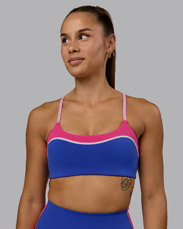 Sports bra with removable padding – Sports bra with padding that can be removed or adjusted for customized support and shape.Embrace Sports Bra - Power Cobalt-Fuchsia Pink