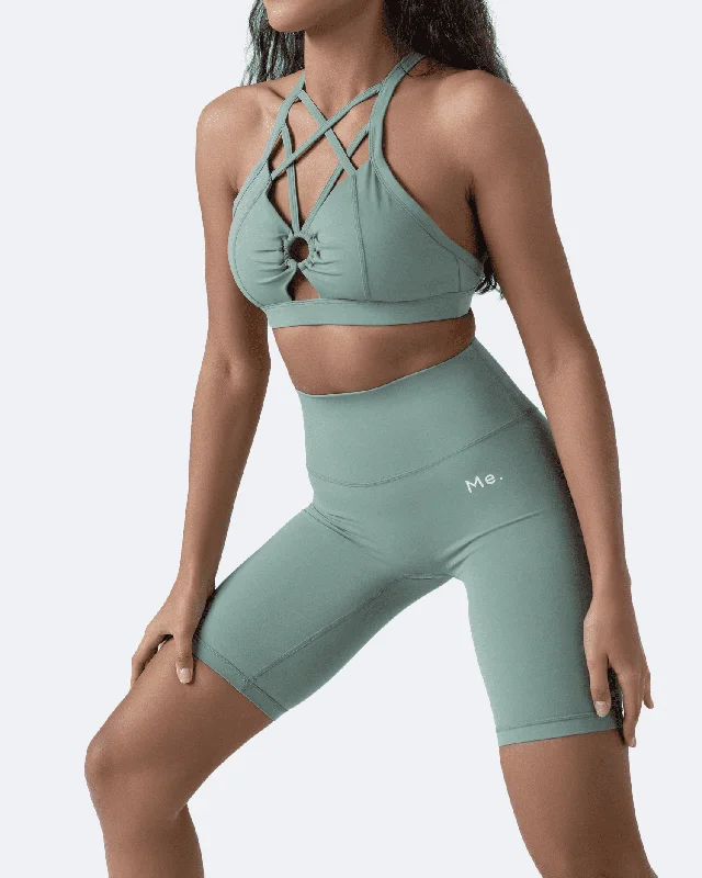 Compression tank sports bra – Combination of a tank top and sports bra, providing full coverage and support for the upper body.Fresh Green Criss Cross Front Top