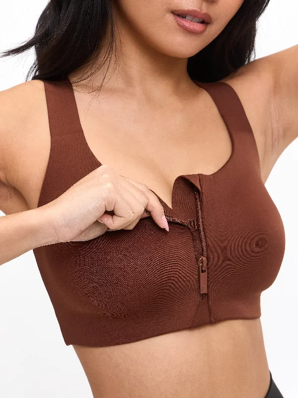 Compression sports bra – Sports bra that compresses the chest for a more secure fit and reduced bounce during high-impact activities.High Impact Zip Sports Bra - Mocha