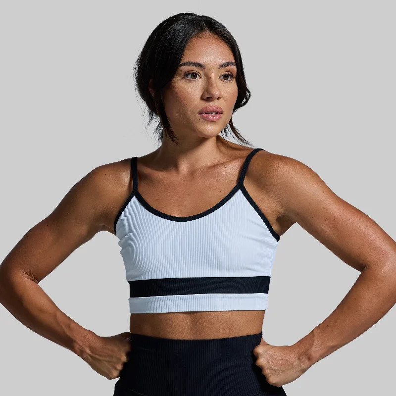 Crossover sports bra – Sports bra with a crossed strap design at the back, offering a stylish and supportive fit.Out of Line Sports Bra (White)