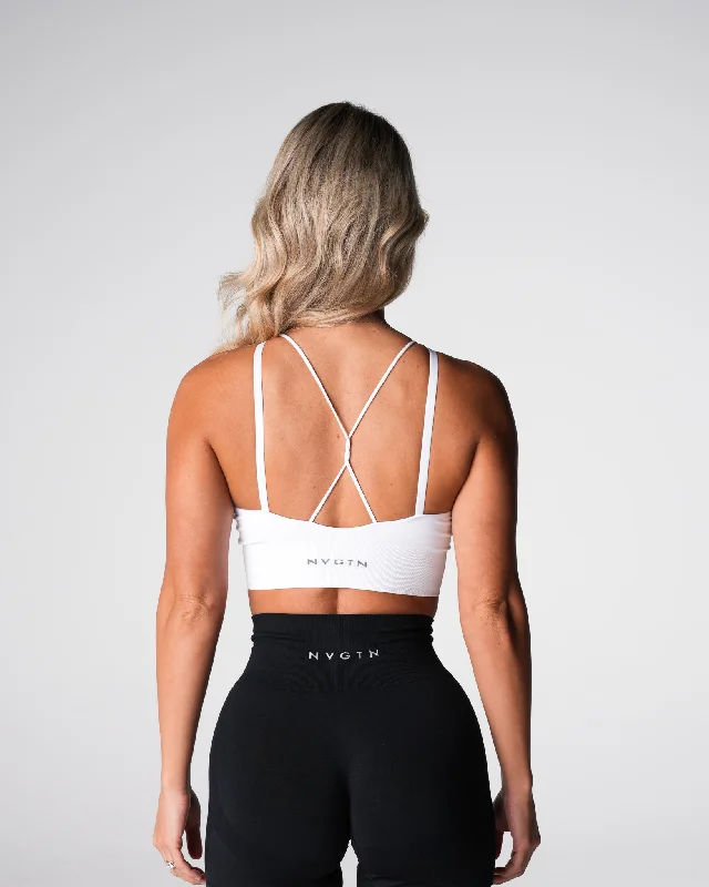 Maternity sports bra – Sports bra designed for pregnant women, offering extra support and flexibility for changing bodies.White Strive Seamless Bra