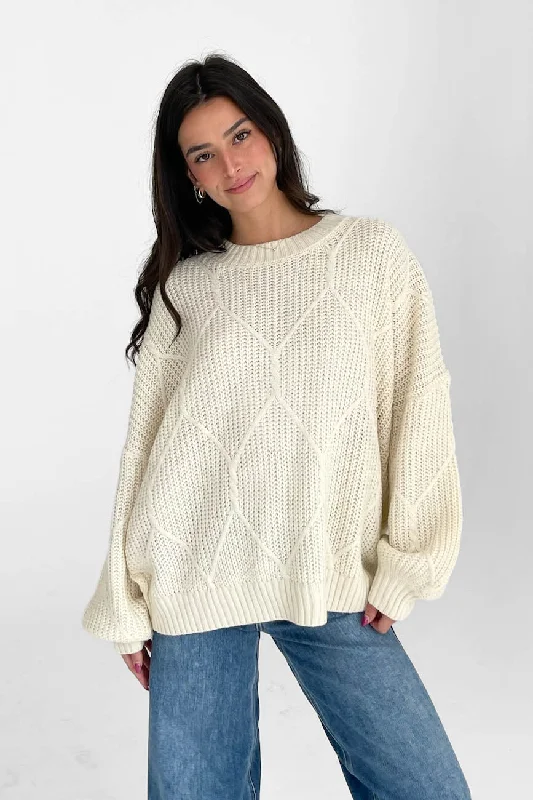 Cardigan – Open-front sweater, often buttoned or with a tieLogan Oversized Sweater in Cream