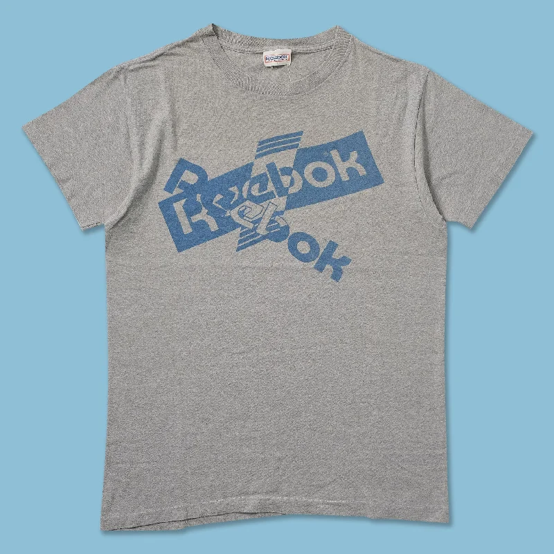 Cotton blend – Mix of cotton and synthetic fabrics for softness and durabilityVintage Reebok T-Shirt Medium